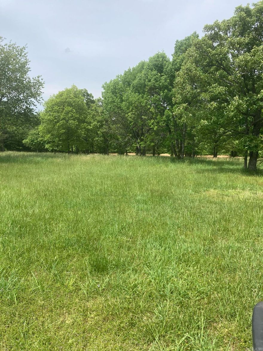 Gorgeous property located in the Ozarks only a few miles outside of beautiful Mountain View! Acreage like this does not become available often!  This one-of-a-kind property is privately located and ready to build your dream home with both mountain and woodland views. It is also the perfect mini farm with areas for gardening, pasture for animals, a chicken coop, small barn, storm shelter, is partially fenced, a cistern, wet weather creek, natural spring, power onsite, public water, and not one, but two, wells, plus a septic system! Maybe you're looking for a private mountain top to park your RV? With a concrete slab, RV power service, and firepit it is ready for the ultimate camping experience. The woodland areas of the property have a beautiful walking trail and a road leading back to a secluded cleared area for another building site or camping area near a bluff line offering gorgeous views. If you're an avid hunter or nature lover, there is an abundance of wildlife including whitetail deer, small game, and fowl surrounded by unmatched natural beauty found only in the Ozarks plus White River trout fishing, the Ozark National Forest, and the world renown music of Mountain View!