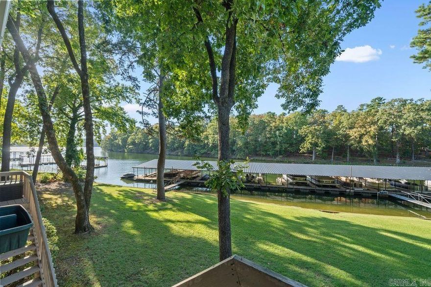 This charming lakefront condo offers a perfect blend of comfort & natural beauty. With 959 square feet of thoughtfully designed living space, this 2-BR, 2-BR unit is ideal for those seeking a cozy condo or a delightful vacation getaway. Step in your outdoor space & breathe in the fresh air while taking in stunning views of the lake. Whether you're sipping your morning coffee or enjoying a sunset barbecue, this outdoor oasis will quickly become your favorite spot to unwind. Location's key, and this condo doesn't disappoint. Just a stone's throw away, you'll find the excitement of Oaklawn Racing & Gaming, where you can try your luck or simply soak in the lively atmosphere. For your everyday needs, a Grocery store is conveniently located nearby, ensuring you're never far from essentials. Hot Springs itself is a treasure trove of outdoor activities. Hike scenic trails, soak in natural hot springs, or explore the charming downtown area filled with unique shops & restaurants. You'll have endless opportunities for recreation & relaxation right at your finger tips. Whether you are nature enthusiast, a water lover, or simply seeking a peaceful retreat, this lakefront offers perfect balance.