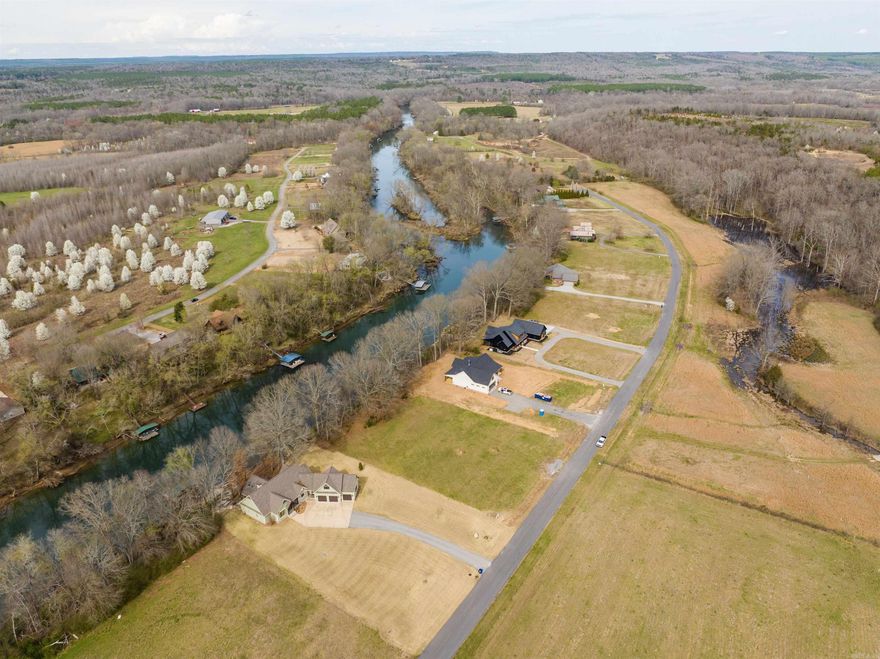 Discover the perfect canvas for your dream home at 135 River Dr Estates, a magnificent 1.46-acre vacant lot nestled along the serene banks of the Little Red River in Pangburn, AR. With generous river frontage, this land is an angler's paradise, boasting some of the best trout fishing opportunities in the area. Imagine waking up each morning to the gentle sounds of flowing water and stepping out to cast a line from your own backyard. Now's the time to embrace the opportunity to build not just a house, but a home that reflects your unique style and offers the step toward creating the life you've always dreamed of by the river. Minerals do not convey