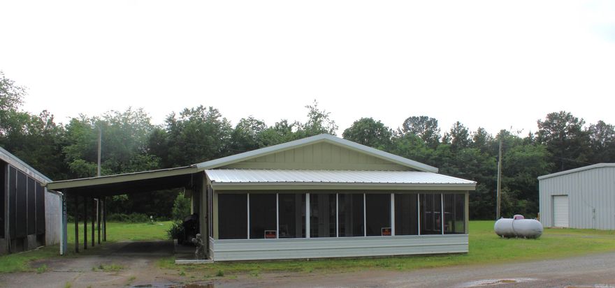 This is a MUST SEE for any & all Investors. House is 1,080 sq ft, has been completely remodeled, 1 bed 1 bath with kitchen, laundry room, and screened in porch and rents for $900. Next door you'll find a 4,100 Commercial building with 4 large offices (appx.1,000 Sq' each) with 1/2 baths in each, two units have been completely remodeled, new electric, plumbing, and sheetrock, two units have roll-up doors in back. 1 Unit has kitchen with 1 bedroom and 1 bath Rents for $500.00. 3 units rent for $400.00 each.