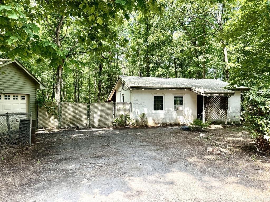 This 1-bedroom, 1-bath home sits on a 2.0 +/- acre wooded lot just 2± miles from Lake Ouachita Shores Resort and the Lake Ouachita Vista Trail (LOViT). Built in 1953 and updated with a metal roof in 2016, the home includes 1,140 +/- sq ft of living space, a Kitchen Aid gas stove, dishwasher, refrigerator, and an owned propane tank. It comes fully furnished, offering a move-in-ready opportunity. A 14x22 detached garage and 12x16 storage building add extra functionality. With city water and a septic system, this property is ideal as a full-time residence or a weekend getaway with easy access to outdoor recreation opportunities.