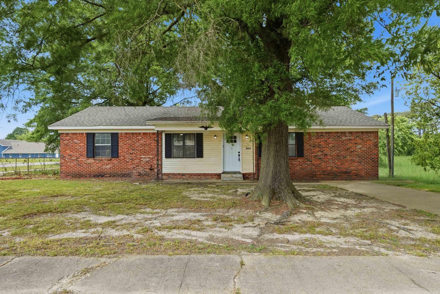 Beautiful home on a corner lot at a great price. Large living room.  3 bed/2 bath with tile floors for easy maintenance. Nice kitchen with electric stove, dishwasher, and microwave. The lot has mature shade trees and a concrete patio area. Architectural shingles on the roof.  Great location with easy access to restaurants, shopping, and schools. Great opportunity for owner-occupants or investors.