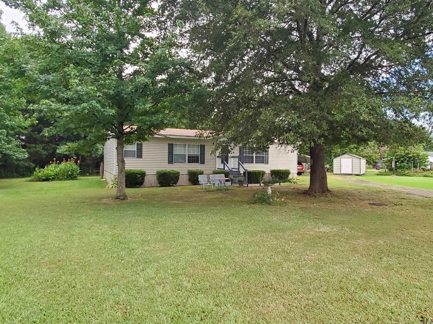 Live the good life on this beautiful 5 acre property teeming with wildlife. Walking trail around entire property.  Well kept double wide 3 bedroom 2 full bath Mobile Home. A couple of sheds for storage. Property also has another site with septic and electric for a 2nd MH if needed.