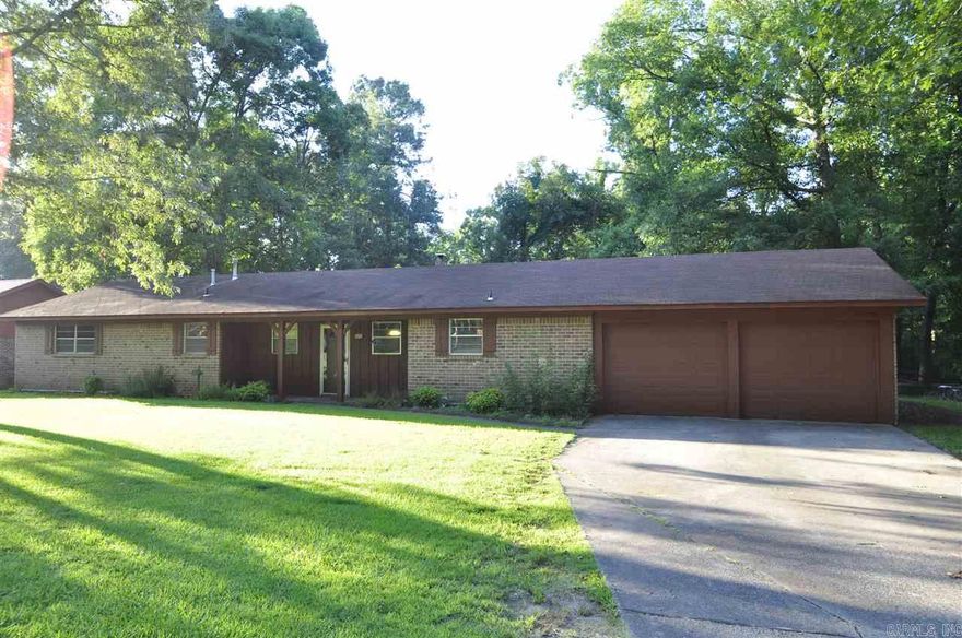 Quality built brick home on 1 acre w/ a 24X30 shop! New HVAC! Brand new flooring throughout the home including; tile in kitchen, carpet in bedrooms & vinyl hardwood flooring in living area. Brick fireplace w/ stove insert & new tongue & groove wood walls in living area. Bath completely remodeled w/ new counters, cabinets, tile & beaded board. Huge living room open to the kitchen & dining area. Master includes; his/her closets & a walk-in shower. Feel like you are in the country but be close to everything!!