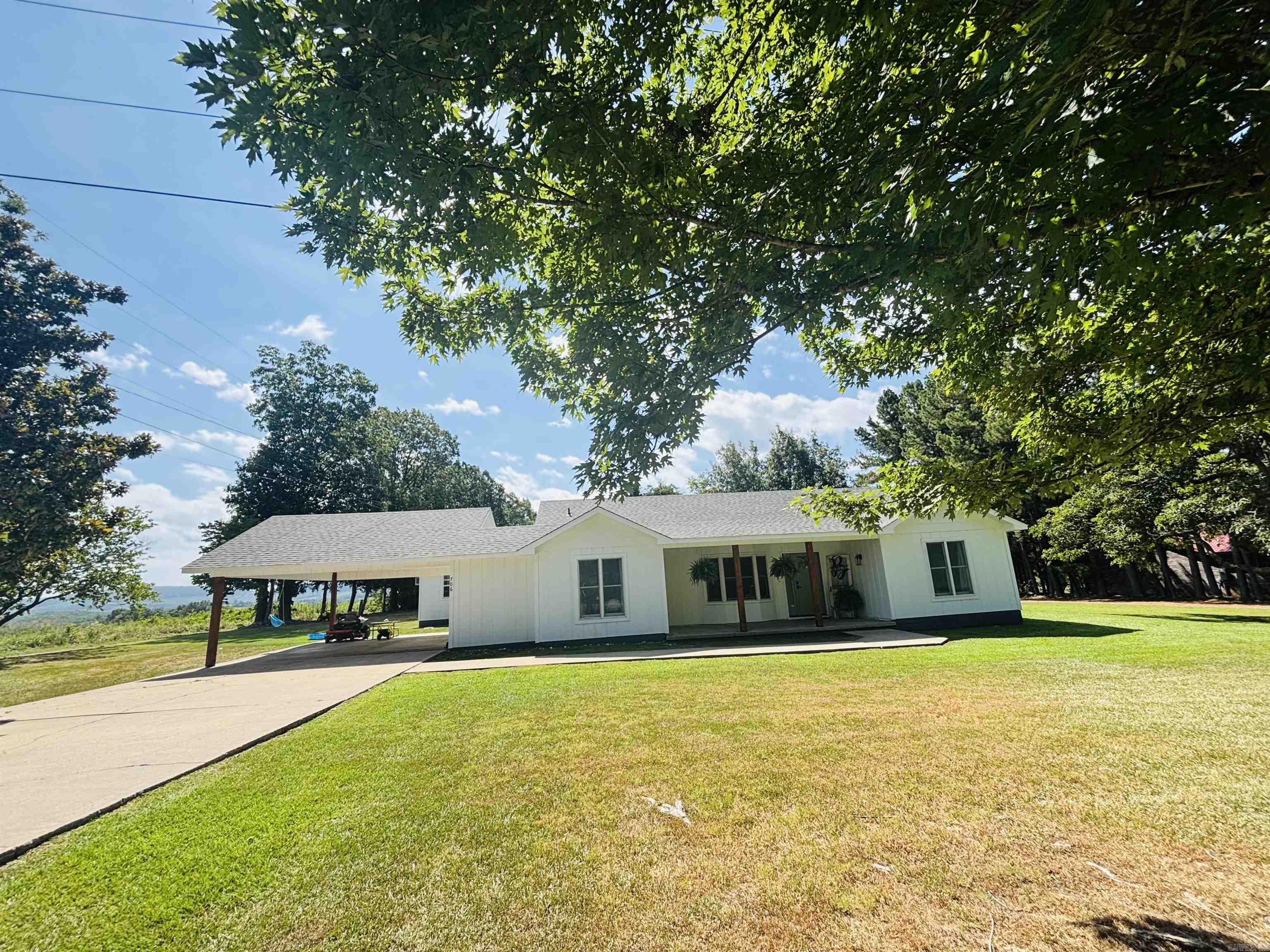 Gorgeous home fronting scenic AR Hwy 333 in Marshall just minutes from the school, Court Square, shopping & the Buffalo National River! Enjoy beautiful sunrises & mountain views from the peaceful back patio of this tastefully updated 3-bedroom 2-bath home offering 1758 +/- sq ft plus a detached structure for use as an office, storage, or guesthouse with an underground saferoom. Stepping into the entry from the covered front porch, the natural light from the large windows & spacious floorplan makes this home so inviting! The living area has a vaulted ceiling, luxury flooring, & a new glass door leading out to the peaceful patio area with views & a beautifully manicured lawn. A perfect setting! The bright updated kitchen has new white cabinets, new sink, & new stainless appliances plus a breakfast nook, laundry room, pantry, & adjoining formal dining room. The well-appointed primary bedroom is privately set apart with a full ensuite bathroom. The other 2 bedrooms offer plenty of storage & easy accessibility to the main full bathroom. Updates include interior remodel, new interior doors, new HVAC, exterior remodel, paint, new exterior doors, & new roof. Nice property!