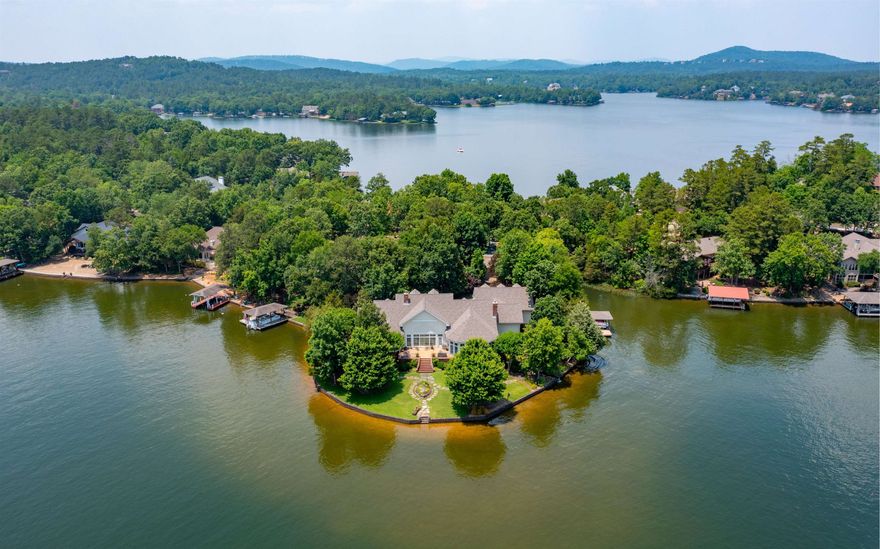 Amazing Custom Gerald Ellison built home on a Private, nearly 3/4 Acre Point on Lake Balboa! Quality everywhere, from the Hardwood Flooring with Inlays, to the Rounded Corners, Coved Ceilings and Walls of Windows overlooking the Lake! In addition to the Owner's Suite with Sitting Area, 5 Piece Ensuite and MASSIVE Walk-in Closet, is what could be considered a 2nd Owner's Suite on the opposite end of the house! The Gourmet Island Kitchen offers Granite/Corian Counters, Concealed Cabinetry for the Commercial size Refrigerator and Dishwasher, and Pass-through to the Sitting Room that enjoys a Brick Alcove with Wood Burning Stove for those cold Winter nights! Zoned Heating, Whole Home Speaker System, Security System, Solid 6 Panel Doors, Large Laundry Room with Wash Basin, Big Pantry. The Glass/Screened Arkansas Room opens to the Huge Patio for the ultimate BBQ! Mature Landscaping for Privacy, Waterfall feature with Creek to the Lake, Covered Boat Dock with Lift, Huge Raised Bed for Garden, and Full Irrigation System! Roof and HVAC System are only 3 years old!