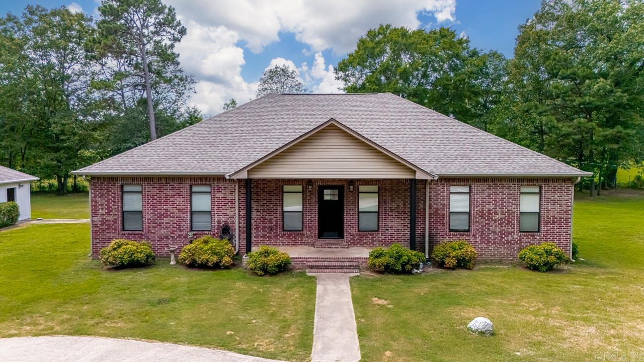 COUNTRY LIVING AT IT FINEST... Amenities include: 2485 Square Feet, 3 Bedrooms, 2 1/2 Bathrooms, Large Living Room, Kitchen/Dining Combo, Living/Kitchen Combo, Open Floor Plan, Separate Dining Room, Office, Large Open Kitchen area with Island Bar, Office Room, Split Bedroom Floorplan, Large Primary Bedroom with Nice Bathroom that boast an Air Tub and Walk-In Shower, Laundry Room, 2 Car Detached Garage, Approximately 5.28 acre Tree Shaded Lot. This property has 2 other structures that match the home, ( 520 Square foot finished studio with stained concrete floors, Htg. and Air, etc. ) ( 2020 Square foot warehouse with bonus room, foam insulation, Htg. and Air, etc.. ), both of these structures could easily be converted to make a great home office, in-law quarters, etc. .. And Much More... This is a must see property..