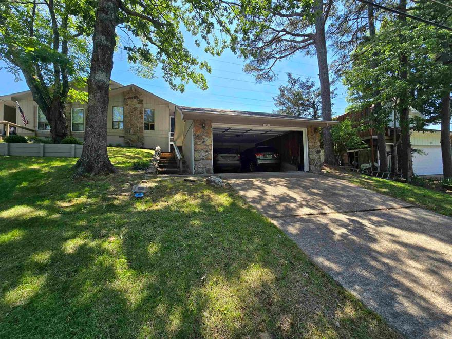 The perfect blasting off point for your Fairfield Bay and Greers Ferry Lake area adventures.  Absolutely clean as a pin and well maintained.  More space and utility than a condo without the condo dues.  With two over-sized bedrooms and two full baths, wood burning fireplace, a large screened back porch, and a two car garage that's just perfect for your lake and trail toys, this home doesn't disappoint!  Situated on a quiet, tree-lined street, with Ed Leamon park right outside the back door, and dining, shopping, music, and festivals within a couple minutes walk in the FFB city center and entertainment district, everything is convenient.  Over 90 miles of interconnecting UTV trails and 20 miles single track and multi-use hiking and biking trials right outside your door allow easy access to the unbelievable beauty of our natural areas.  Not to mention the hundreds of hiking, biking, and UTV trails in the immediate surrounding area and the fun and beauty on Greers Ferry lake.  All of this and much, much more, waiting for you to come and see.  This could be the start of your family's best summer ever!