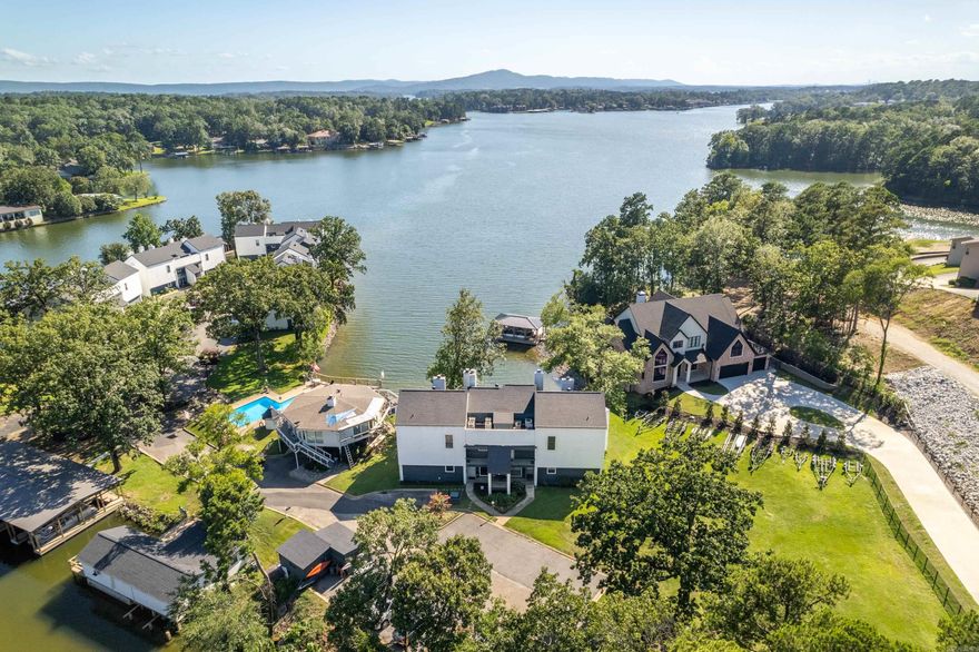 Lakefront Living on Lake Hamilton! This beautifully maintained 2-bedroom, 2-bath condo offers stunning views of Lake Hamilton, located in a gated community for added peace of mind. Walk- in level with zero stairs making this condo easily accessible for all. Enjoy morning coffee or evening sunsets from your private patio overlooking the water. Includes a covered boat slip ( built 2024), making lake days effortless. Perfect for a weekend getaway or full-time lake living—don’t miss this opportunity! No Short term rentals allowed.