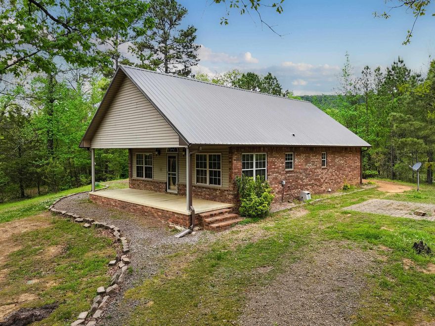 Charming country home situated on over 9 acres, offering 2 bedrooms, 2 full baths, and a flexible bonus room that can be used as an office, guest space, or hobby room. The home features a comfortable layout with a spacious living area and functional kitchen. Enjoy the privacy and room to roam outdoors with plenty of space for animals, gardening, or recreation. A detached shop building provides additional storage or workspace. Ideal for those seeking peaceful rural living with room to grow.