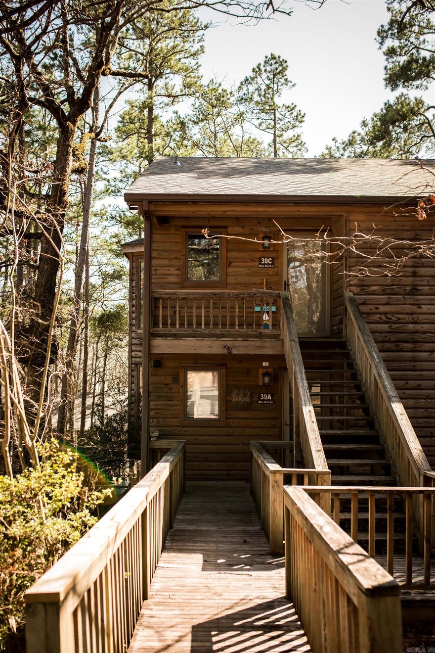 Live that Lake Ouachita Life!  This upper corner unit has been updated and is move-in ready for you! Beautifully renovated 2 bedroom, 2 bath unit is perfect for a vacation property to use and enjoy or as an investment - or both. Rental history available if desired and comes furnished with everything you need. Enjoy the vaulted ceiling AND lots of trees for privacy on the deck. Located near Turtle Cove Spa and the swimming pool. Call today for your private showing.