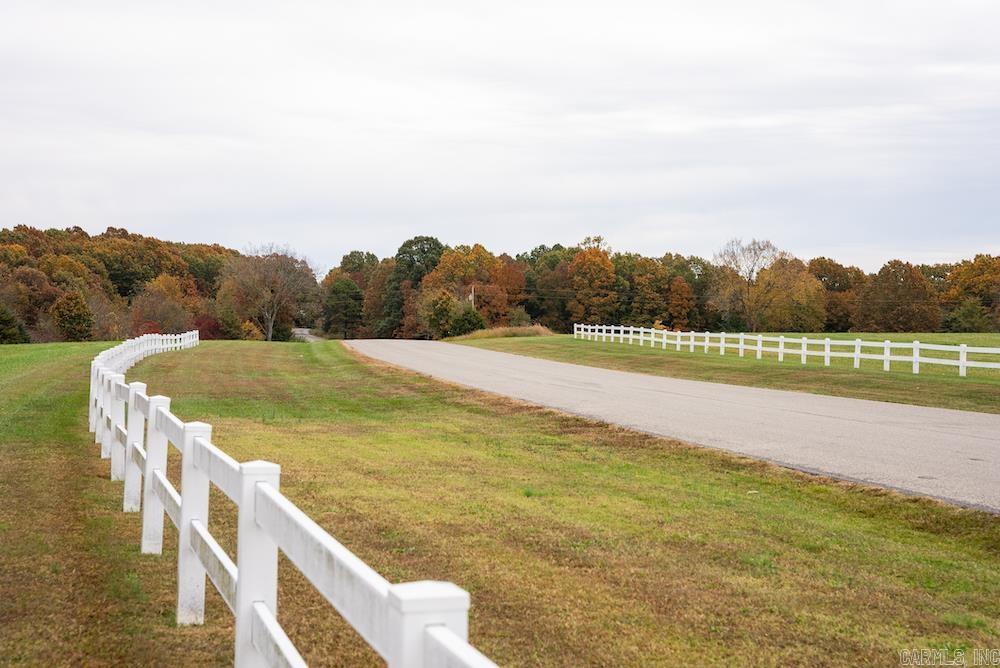 Excellent building or recreational tract with paved road frontage. This property sports the frontage of Hwy 311 and the paved county road 663. Electricity is accessible through a portion of the land. This tract has some established hay meadows, an excellent wildlife population, and is also loaded with marketable hardwood timber. This tract has a combination of a large ridge, wooded valleys, large oak flats, and ample hunting locations and building sites. Several ATV/UTV trails will assist in navigating the beautiful rolling terrain. Beautiful building sites are sprinkled throughout for a potential short-term rental, vacation home, or dream house. Table Rock Lake is just a few minutes down the paved county road, and there is access to a public boat launch near Cricket Creek Marina, Long Creek Marina, and Big Cedar Lodge. The area is prime for investments and developments alike, with the renowned Table Rock Lake right down the road, a quick drive from the famous Branson, MO, and many other remarkable area attractions. This region is known for its tourist attractions and recreational destinations that fit anyone. There are no restrictions, and additional adjoining land is available.