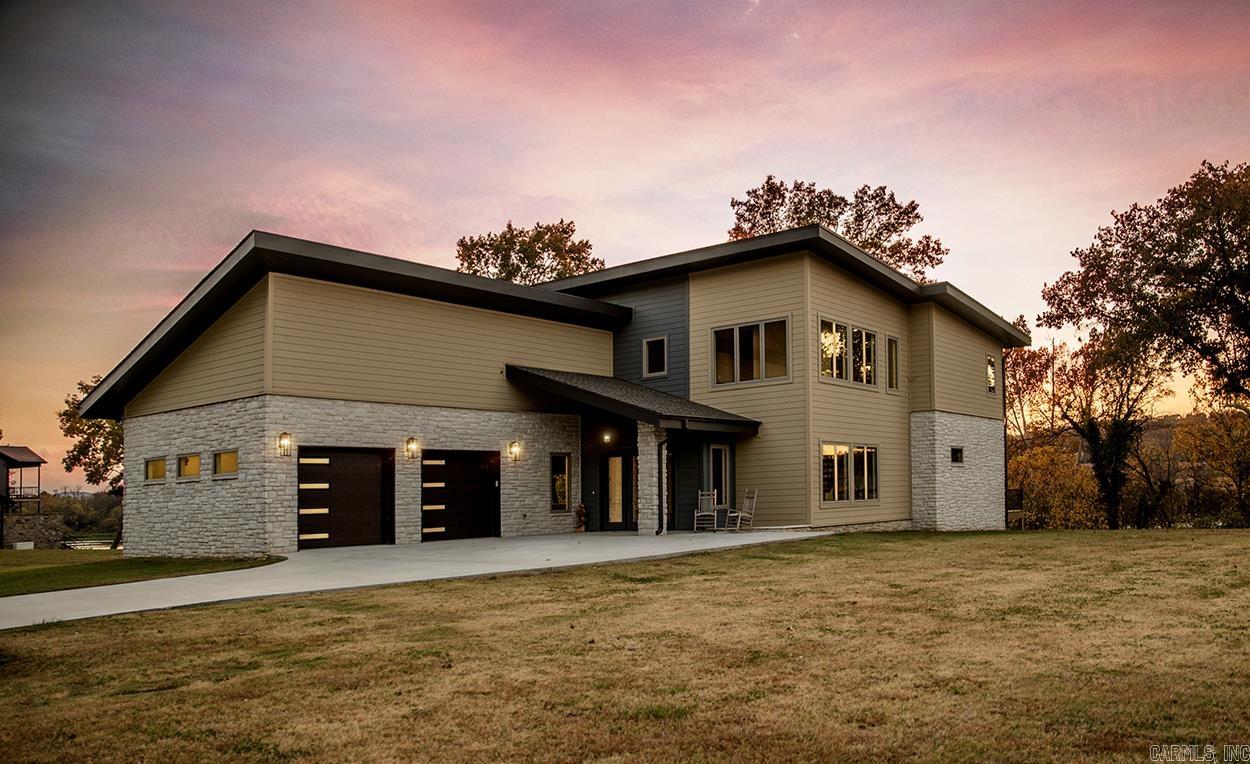 Modern architecture and a backdrop of the White River create extraordinary curb appeal. This 3 bedroom, 3.5 bathroom home has two living areas. The open concept living, dining and kitchen area provides a fantastic space for entertaining. Upstairs, you'll find 2 bedrooms, 2 bathrooms, spacious bonus room plus office space. Additional features include an elevator, indoor pool, low maintenance deck, two car garage, laundry room, and city water and city sewer services.