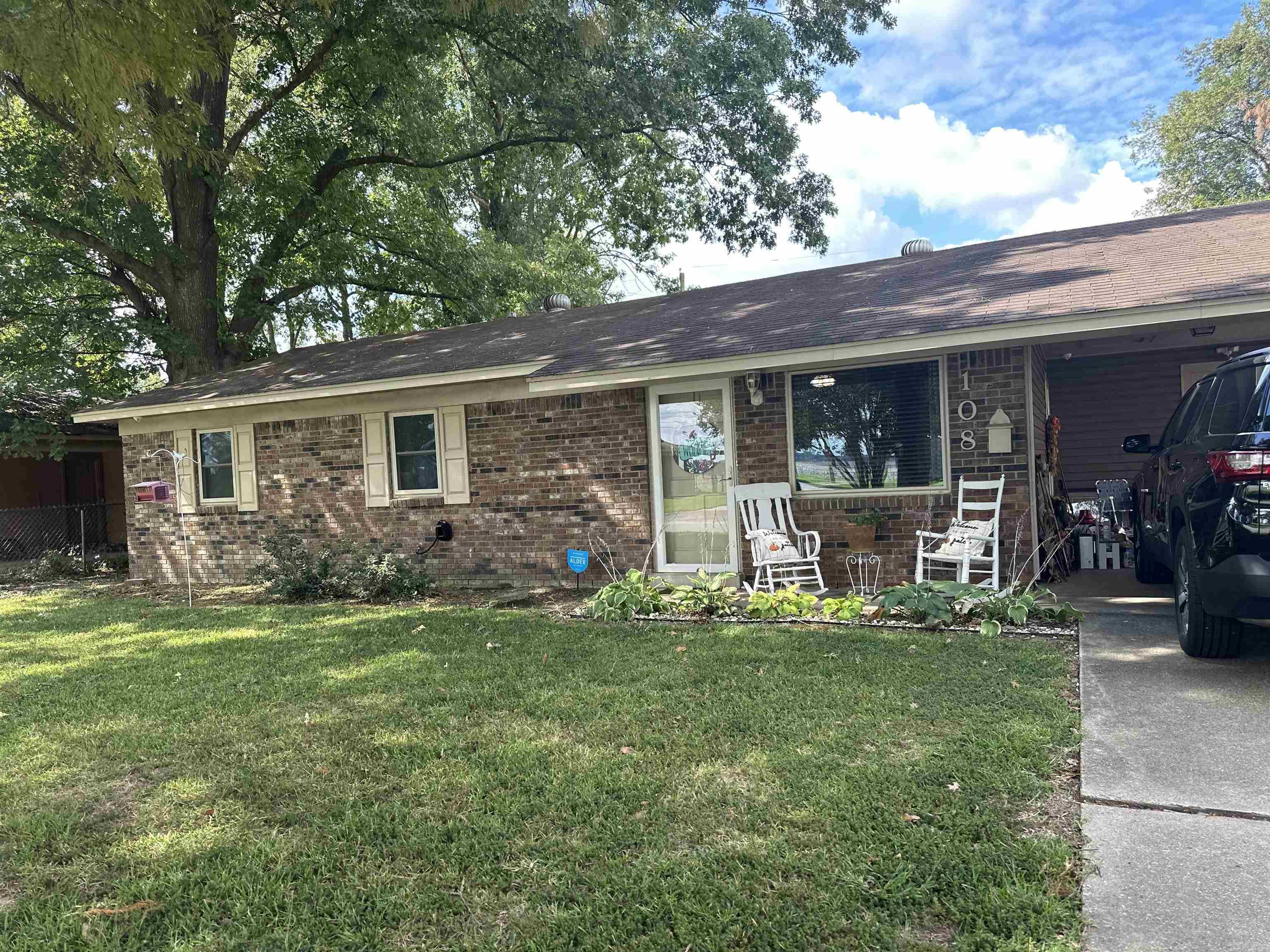 Charming 2-Bedroom Brick Home with Modern Updates and On-Demand Generator!  This well-maintained brick home offers comfort and convenience with many updates completed in the past 5 years. Featuring granite countertops and a completely remodeled bathroom (less than a year old), this home is designed for low-maintenance living. Enjoy the oversized shower with a glass door, fold-in insulated windows, and new siding, all contributing to energy efficiency and ease of care.  Stay comfortable year-round with ceiling fans throughout, and rest easy knowing you have an on-demand Generac generator for peace of mind. Originally a 3-bedroom, the current layout offers a spacious primary suite with a sitting area, or it can easily be converted back to a third bedroom.  Step outside to relax on the covered patio, and appreciate the carport and storage shed with a lean-to for extra storage.  Perfect for those seeking a move-in-ready home with both character and modern upgrades!