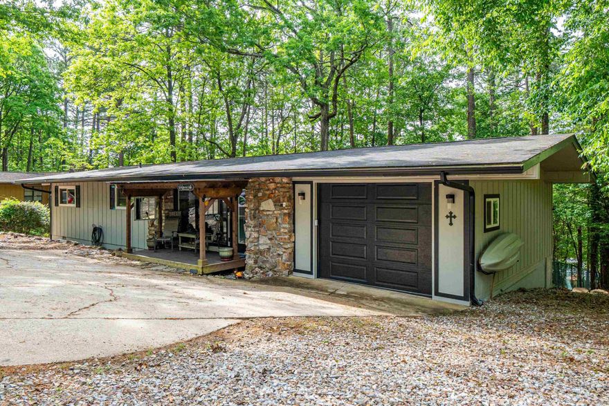 A wonderful 3/2 located in Hot Springs Village. It has been updated with granite countertops and pergo floorings, new windows, hot water heater, walk-in closets in every bedroom and walk-in shower in primary bath. There is an unfinished basement thats is great for storage. The village offers so many amenities including - golf courses, lakes, and walking trails. There is a buy in fee for first time buyers for the village.