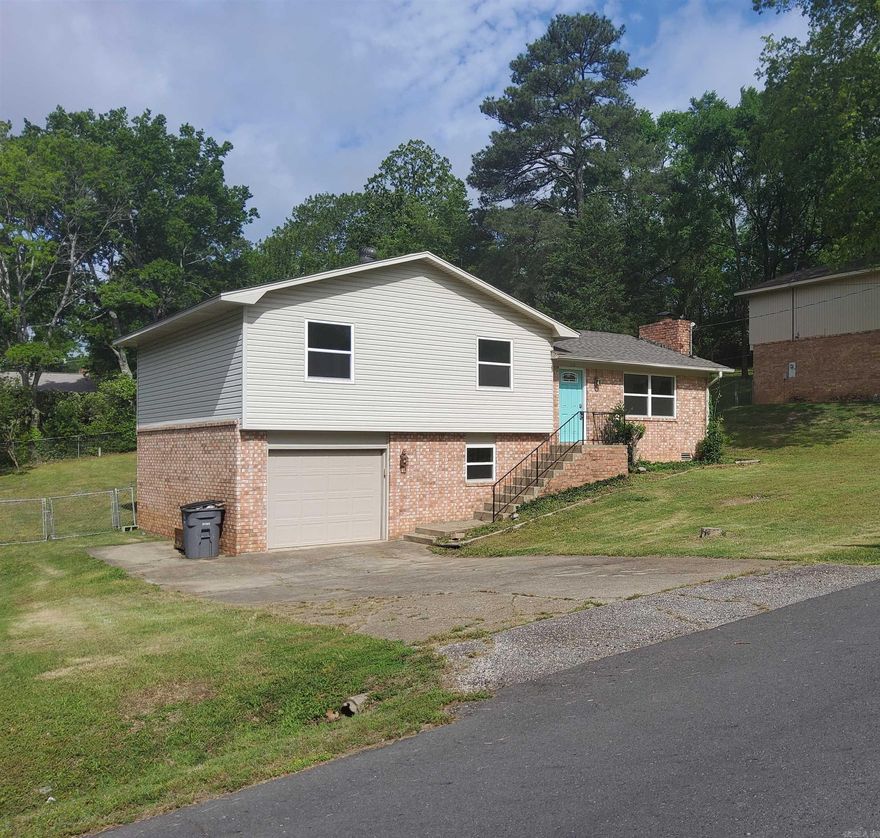 This beautifully remodeled 3-bedroom, 2-bath home offers modern updates throughout, including brand-new flooring, fresh walls, an upgraded kitchen, a new roof, and energy-efficient windows. The spacious multipurpose bonus room downstairs could easily serve as a 4th bedroom or additional living space to suit your needs. Key updates also include new kitchen plumbing and electrical improvements, adding significant value to this home. Enjoy the outdoors on the newly renovated deck overlooking the backyard. Conveniently located near shopping, medical offices, dining, and Oaklawn, this home combines comfort, functionality, and prime location.