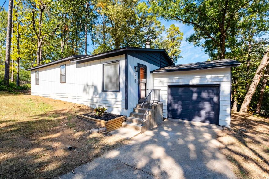 This stunning 3 bed/2 bath home has been completely renovated inside and out! In just the last 60 days, this home has been brought back to life with a new architectural shingle roof, new LVP flooring throughout, updated light & plumbing fixtures, freshly painted interior & exterior, newly constructed back deck and so much more! The kitchen has been fully renovated with brand new cabinets & hardware, sleek granite countertops and new stainless steel appliances. Both bathrooms were also gutted and boast a custom tile walk-in shower w/ frameless glass door in the primary bath, new tub w/ tile surround in hall bath & new free-standing vanities/toilets in both. HVAC (A/C & furnace) replaced in 2023 & water heater replaced in 2022. One-car garage with auto door opener & add'l storage room (w/ exterior access).