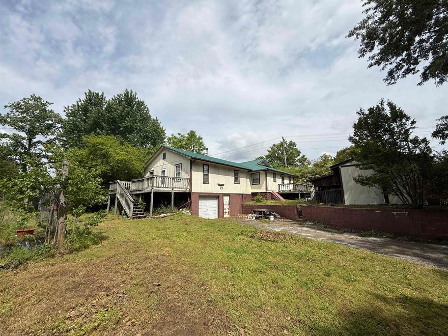 This 3-bedroom, 2-bathroom home is situated on 20.43 acres just outside Oxford, Arkansas, offering small-town living and plenty of space to enjoy. The land is fairly level and features a balanced mix of open ground and big timber, making it ideal for livestock, recreation, or simply enjoying the outdoors. Two ponds, both stocked with fish, add to the property’s appeal, along with a functional cattle corral, run-in shed, and a small hay barn. TThe home is an older-style residence with solid features, including a metal roof that is only 5 years old and central heat and air with a heat pump and gas backup for added efficiency. With 3 bedrooms and 2 bathrooms, the layout offers comfortable living space and is ready for your personal touch. This property is vacant and move-in ready, making it a great option for a full-time residence, hobby farm, or investment opportunity, all at the low price of $127,500.