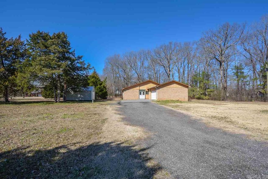Location Location!! Open floorplan split bedroom home on 1.71 acres of beautiful land. Deer, Wildlife, mature Evergreens, Apple, Pear, and Cherry Trees. Gorgeous rock & stone wood-burning fireplace accented with arched windows. New roof-2017, some updated vinyl windows, new tile floors throughout, HVAC-5 years, new tile kitchen counters and Stainless Steel appliances-2014. Large bedrooms with Jack-and-Jill bathroom. Front entry mud room. Triangle shape level lot provides for the ultimate space and privacy.