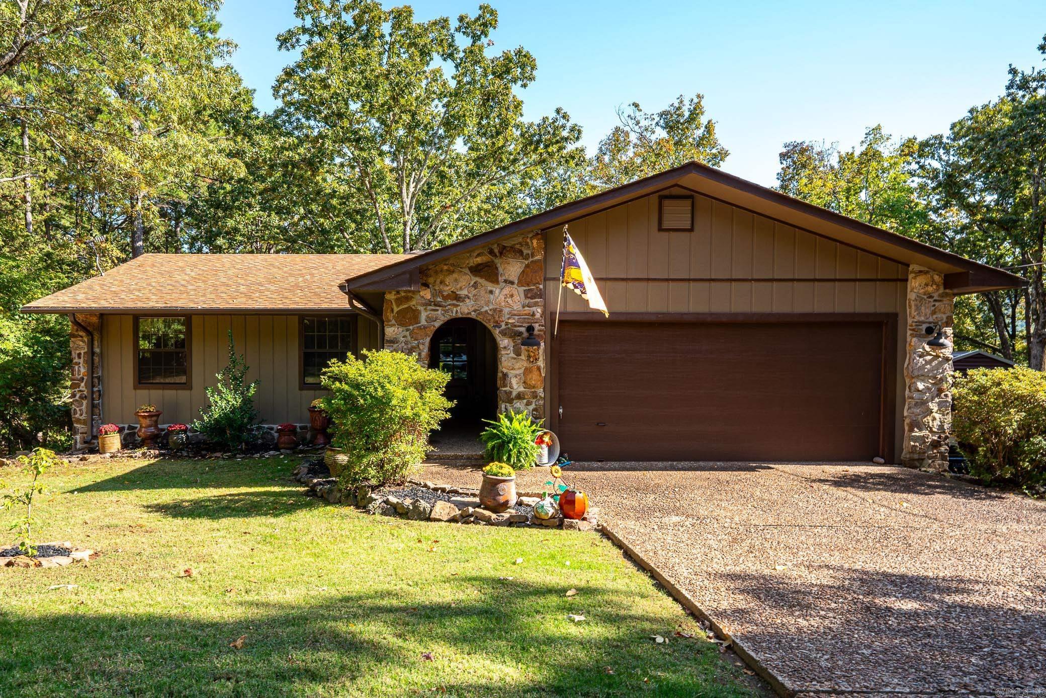 Completely remodeled 3 bed/2 bath house in culdesac. Remodeled by Greg Lock Custom Homes. Upgrades done in 2022 include: 2 remodeled bathrooms with walk in tile showers, LVP flooring throughout living areas, granite counter tops, all new paint inside & out, covered back deck that offers incredible views of the property with a stairway leading to backyard, architectural shingled roof, front door, custom barn door in master bath entrance, & new HVAC. Eat in kitchen also features stainless steel appliances, bay window overlooking backyard and a pantry. Over 700 sq. ft. completely finished Walk out basement is the perfect spot to entertain, home office, or extra living room. Home also features 640 sq. ft of deck (352 sq. ft. covered) overlooking the 1.27 acre lot (7 lots total) & additional storage with a walk in crawl space. 200' from lake with Lake view and views of Sugarloaf in the winter. Wooded, sloped, & a perfect setting to enjoy nature in your own backyard. 2 car garage with an additional 30'X24' metal carport to provide onsite storage large enough for boat. Pool table, deer feeder, lamppost will convey. 2 Church doors leading to hallway will not convey. Agent see remarks.
