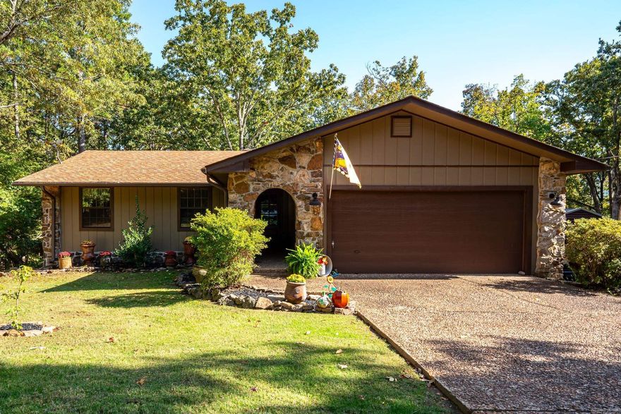Completely remodeled 3 bed/2 bath house in culdesac. Remodeled by Greg Lock Custom Homes. Upgrades done in 2022 include: 2 remodeled bathrooms with walk in tile showers, LVP flooring throughout living areas, granite counter tops, all new paint inside & out, covered back deck that offers incredible views of the property with a stairway leading to backyard, architectural shingled roof, front door, custom barn door in master bath entrance, & new HVAC. Eat in kitchen also features stainless steel appliances, bay window overlooking backyard and a pantry. Over 700 sq. ft. completely finished Walk out basement is the perfect spot to entertain, home office, or extra living room. Home also features  640 sq. ft of deck (352 sq. ft. covered) overlooking the 1.27 acre lot (7 lots total) & additional storage with a walk in crawl space. 200' from lake with Lake view and views of Sugarloaf in the winter. Wooded, sloped, & a perfect setting to enjoy nature in your own backyard. 2 car garage with an additional 30'X24' metal carport to provide onsite storage large enough for boat. Pool table, deer feeder, lamppost will convey. 2 Church doors leading to hallway will not convey. Agent see remarks.