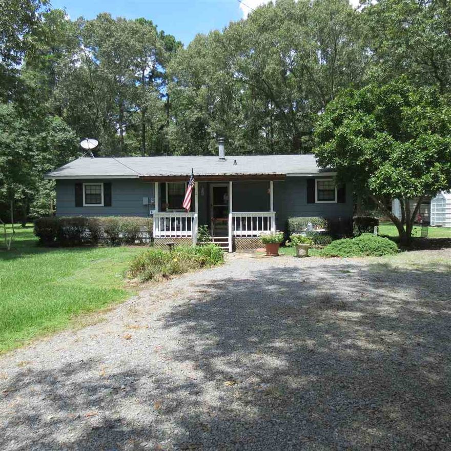 Well maintained home outside city limits, but still close to town!!  This home has a split floor plan, 3 bedrooms and 2 baths.  Carport outside, outside storage building.  Front porch to sit out for your morning coffee.  Taxes are after Homestead Credit. Don't miss this home, call today for your personal tour.  Qualifies for NO DOWN Payment, call me to find out more details!!