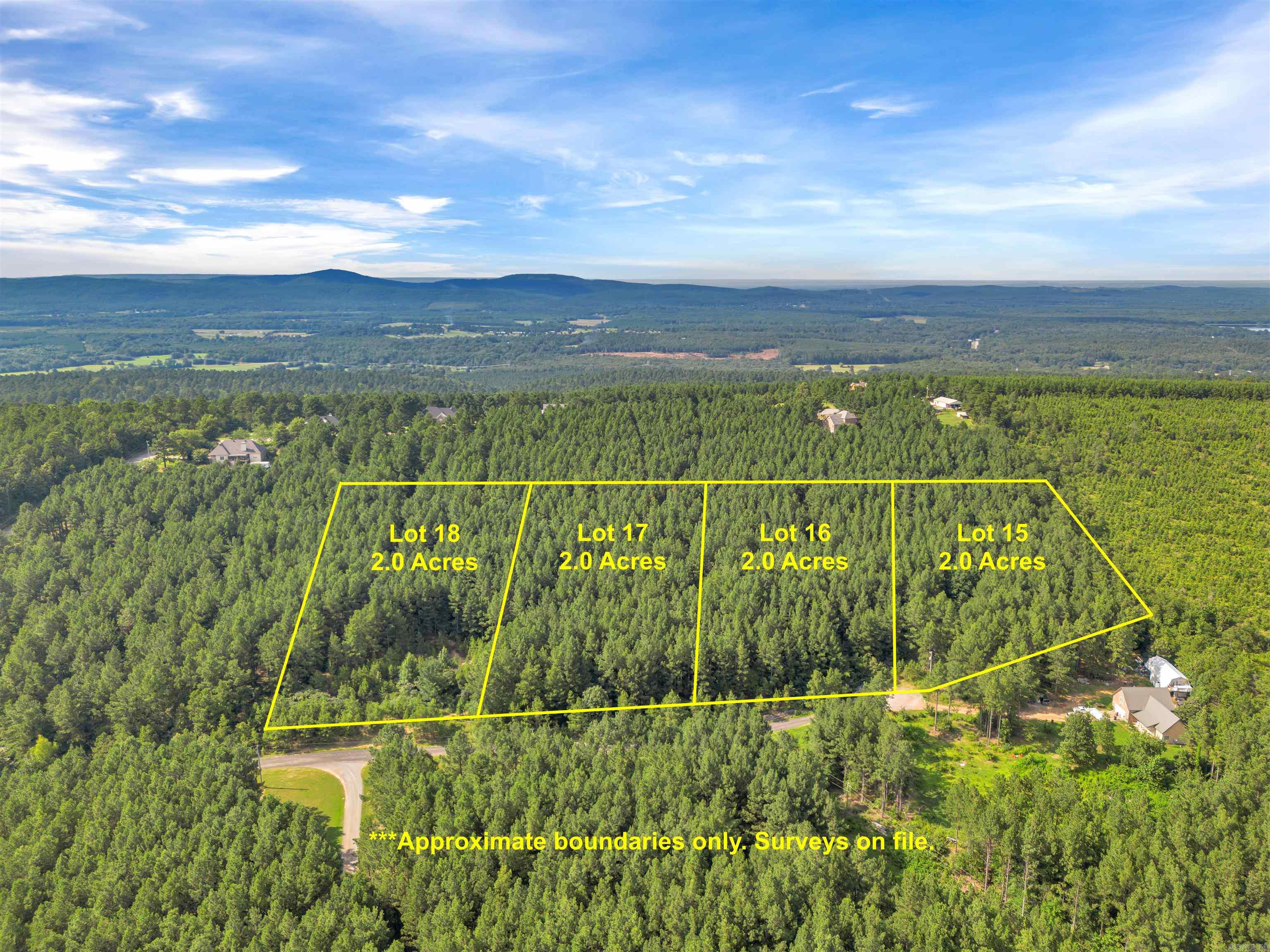 This listing is for Lot #15 in Big Rock Estates Subdivision. Discover this beautiful wooded lot located in the desirable Big Rock Estates subdivision in Perry County. This property is located right by the Ouachita National Forest and surrounded by Potlatch Deltic lands. This lot #15 connects directly to hundreds of acres of Deltic Timber land on the eastern side. Surrounded by beautiful custom-built homes, this lot offers a peaceful setting for your future home. Purchase individually or combine multiple lots for more acreage. A minimum of 1,800 sq/ft is required for new construction. Mobile and manufactured homes are not permitted. City water and electricity are available at the road, and fiber internet is accessible. Septic system installation will be required.
