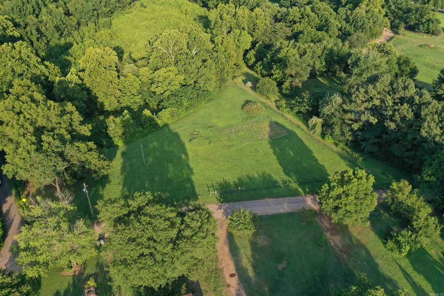 • Electricity in Place • City Water in Place • Septic in Place • Fiberoptic internet in Place • Completely Fenced • Seasonal Creek • County Road frontage • Less than a Quarter Mile from Highway 10 • Mature hardwood trees for shade • No Restrictions • Minutes outside of Havana • Mount Magazine minutes away • National Forest just minutes away