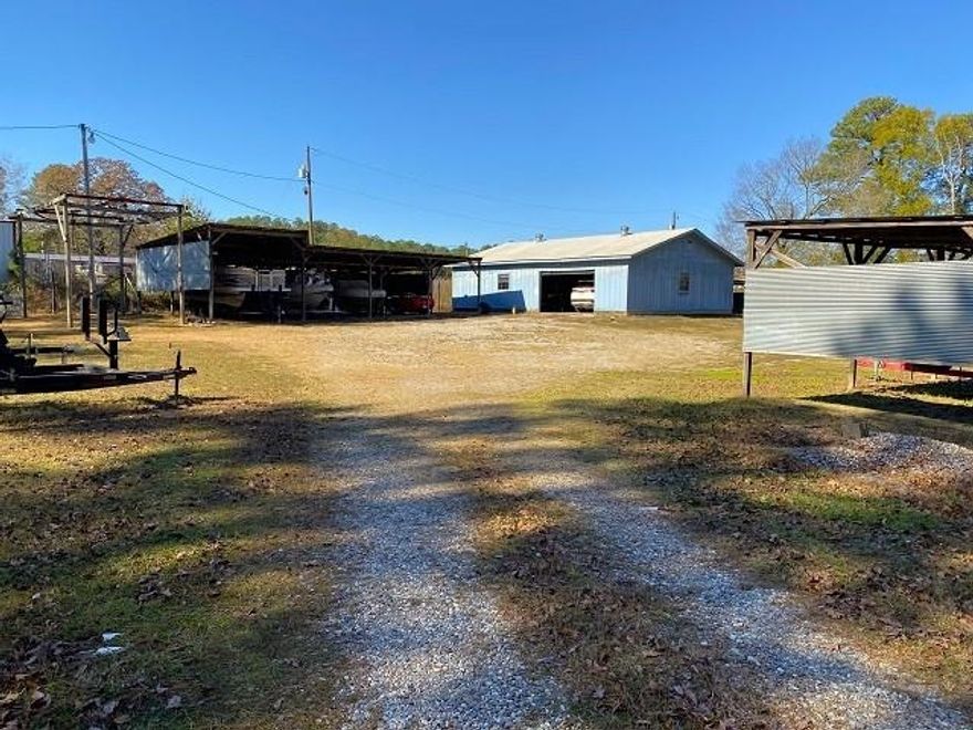 Commercial property close to Lake Ouachita & Hamilton. 1280 sq. ft Bldg was a J & S Marine seller retired. this Bldg. can be used as business, Warehouse, 24 storage units for boats, cars, campers & RV's surrounding the Bldg plenty of land to double the amount of storage bldgs. 1344 sq. ft 1987 3/2 DW Mobile home, decks on front & back. 18 X 20 Carport with a dirt floor. 9X9 & 9X11 Storage/utility bldg. metal, concrete floors. Income Producing Property.  Boat Lift dual winch could be used to remove car engines as well. 436.5 LF HWY Frontage on Albert Pike. All kinds of Income Potential. Plenty of room to build house if preferred.