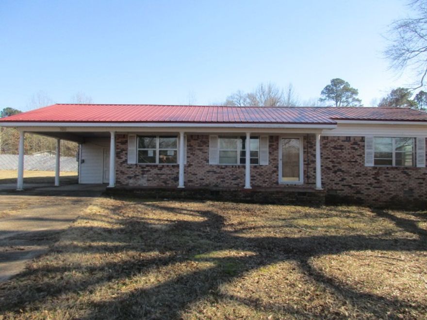 Home on large lot in Monticello.  This home has 4 bedrooms and 3 living areas.  Investors take note.  A little TLC and personal touches could make this your new home.  The taxes are before Homestead Credit.  Acreage and square footage was obtained from County Parcel Card, measuring is encouraged.  Property was built prior to 1978 and lead based paint may potentially exist. This property may qualify for Seller Financing (Vendee). **Agents please see Remarks**