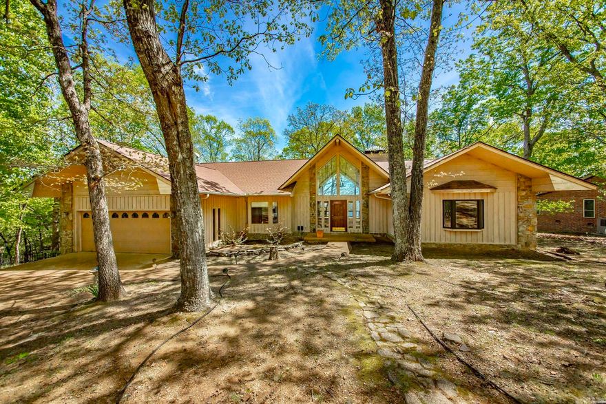 You will love this charming home in Diamond Bluff nestled in the woods with breathtaking views of Greers Ferry Lake!! The floor plan encompasses 3 roomy bedrooms, 3 bathrooms giving you 2,582sf of spacious elegance! The generously proportioned interior flows effortlessly from the open-plan living space to the private screened in porch and rear deck perfect for family gatherings! All of this situated in a convenient, friendly neighborhood. Nature and tranquility are calling your name, schedule a private tour today to see this lovely property!