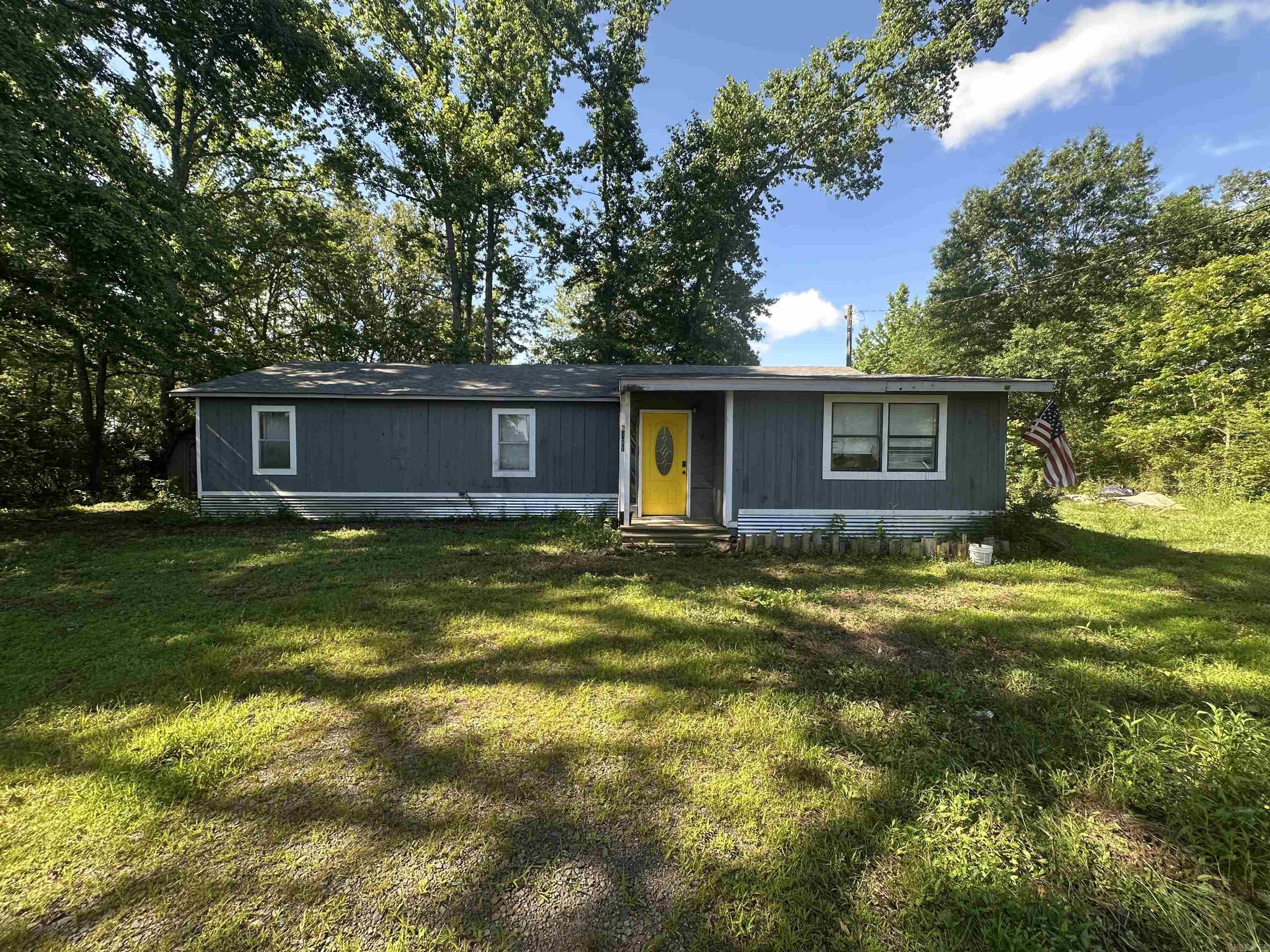 Home for sale with the land behind it, good acreage and room in back yard. Home being sold AS-IS, no property disclosure available.