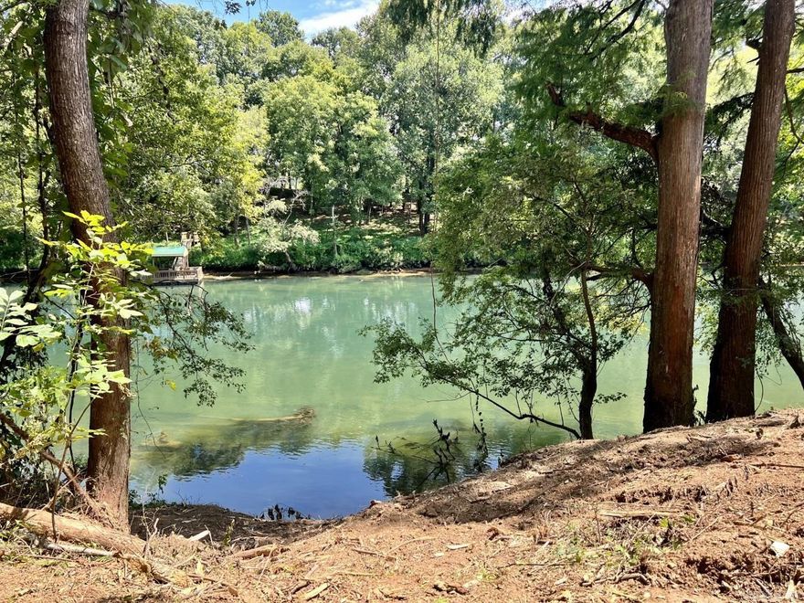 A breathtaking building lot located on the Gorgeous Little Red River.  Large 3 acre +/- lot with approximately 234 feet of river frontage.  The land has been mulched and is easy to see & to walk to the river.  Located in the newly developed River Creek Estates Subdivision. No mobiles, chat road, utilities available, minimum sf is 1200 and some lots have a set back due to the regulatory flood way.  Water and electric are at road.  Mineral Rights do not convey