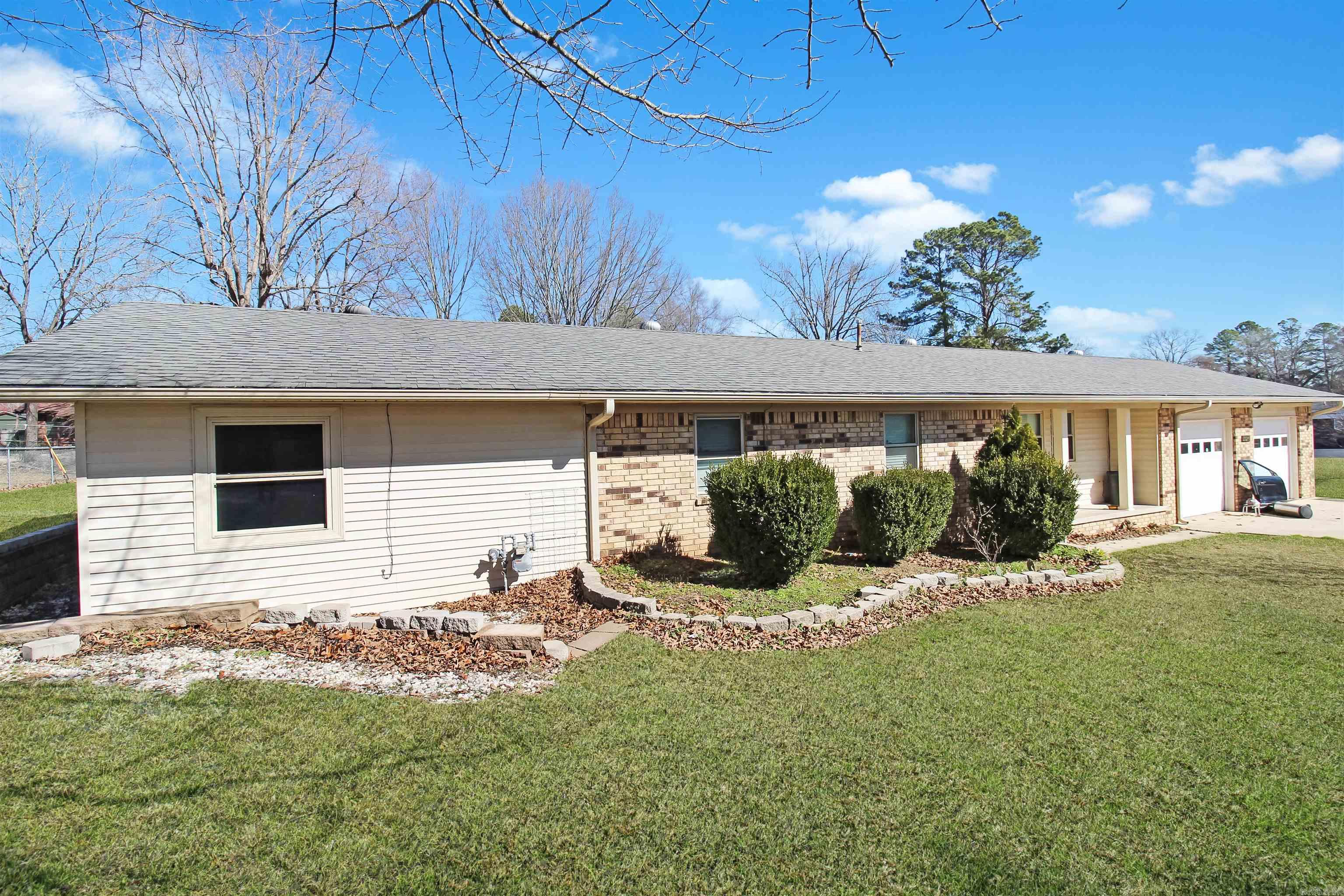 Four bedrooms and 3 full baths!*newer roof*full house generator*wonderful shop*mother in-law quarters*high quality insulated windows*two gas water heaters, one of which is an "on demand"*2 car garage*3 city lots*fenced backyard*mostly brick including shop*no property disclosure*seller is out of state*THIS PROPERTY IS NOT IN A HOA*