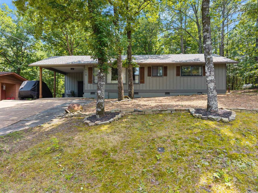 This beautifully updated 2 bed, 2 bath home is tucked away in the heart of Fairfield Bay and just a short walk to the ever popular cliffs at Snakehead Cove on stunning Greers Ferry Lake. Inside, you'll find an open concept layout with vaulted, shiplap ceilings, two spacious living areas, and a cozy, welcoming feel throughout.  The flexible second living area offers extra space for guests or entertaining. The kitchen features abundant cabinetry and flows seamlessly into the main living and dining areas- perfect for gatherings. Step outside to a spacious deck, partially covered for dining and relaxing outdoors. The backyard fire pit is the ideal spot to unwind after a day on the lake. This home has been thoughtfully remodeled inside and out, including fresh exterior paint, new gutters and shutters, an amazing deck and a revitalized shed with matching updates. A roomy laundry and pantry area adds convenience, and all appliances, including refrigerator, washer and dryer will convey! Whether you're looking for a full time residence or a weekend getaway, this lake-area gem has it all- location, style and comfort in one of the most beautiful lake areas in Arkansas. Agents - see remarks.