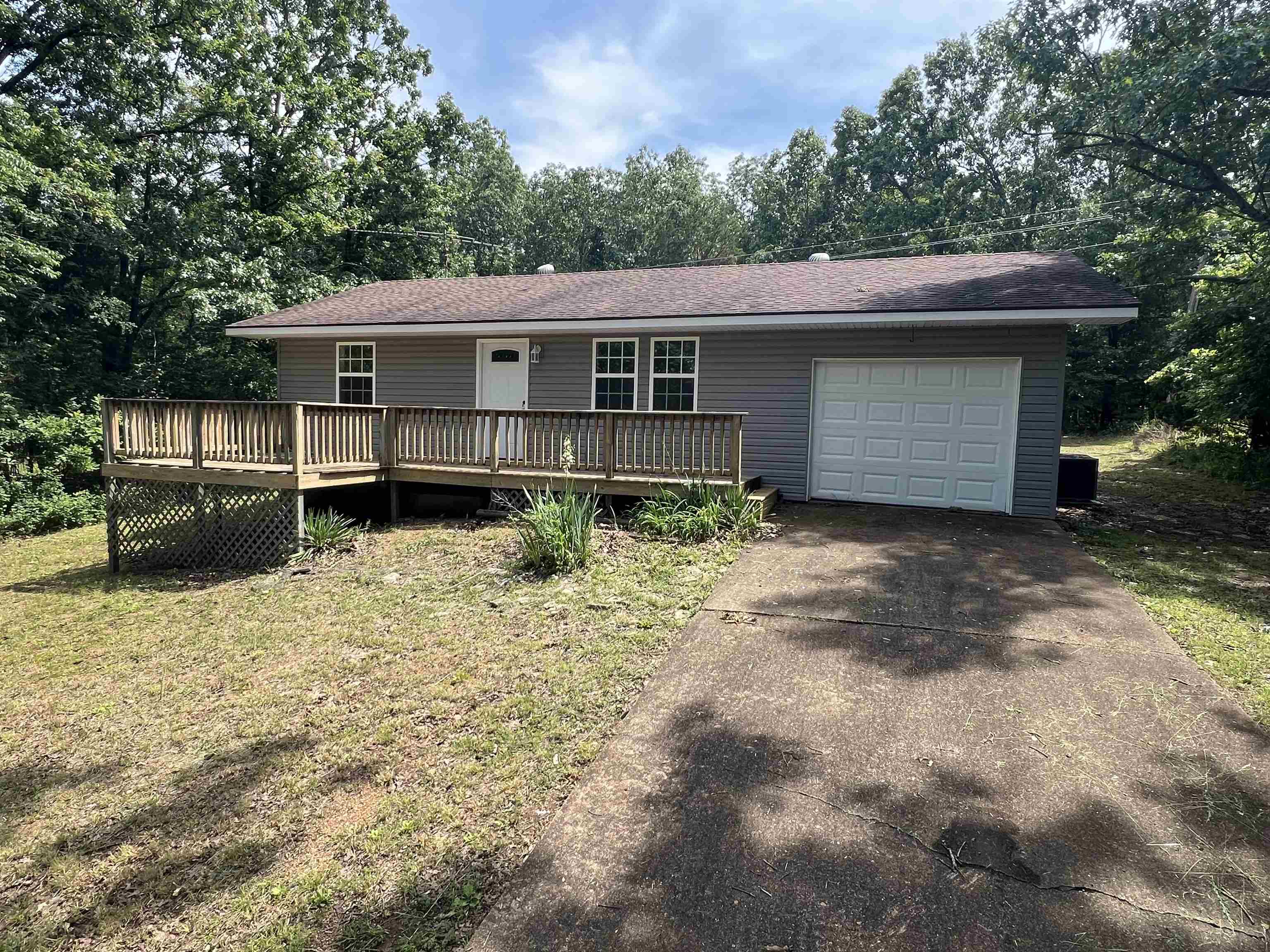 This charming home features 2 bedrooms, 1 bathroom, and sits on a .3 acre lot within the city limits of Horseshoe Bend. Recently renovated with brand new central heat and air, all new electrical and plumbing, and beautiful hardwood flooring throughout. The home includes a laundry/pantry combo room and a 1 car garage, making it both practical and cozy. Move-in ready and perfect for a first-time buyer, downsizer, or investment opportunity.