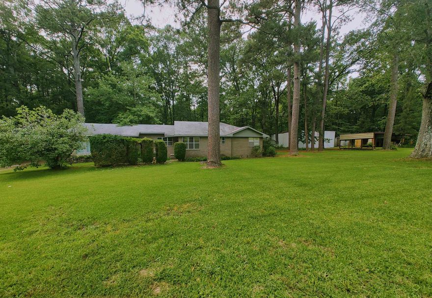 If you're wanting to be in the city but also want that country living feel, then this is the home for you. It features 4 Bedrooms, 3 full bathrooms (2 have been remodeled), NEW ROOF Feb 2024, 1.82 acres, a 50' by 50' by 20' tall slab shop/shed w/garage door, a 3 car carport, covered back porch, a second building (see photos) that can be used commercially or as a mother-in-law quarters, located on a dead end road with plenty of privacy, and so many more features that you must check out! Offering a 3rd party home warranty as well. Oversized refrigerator/freezer and washer/dryer conveys. Schedule a showing today!  Please check out our other two listings 12525 Damon Lane 5+/- acres of land and 000 Damon Lane 5 +/- acres of land which are right next to this listing on the south side of the property.