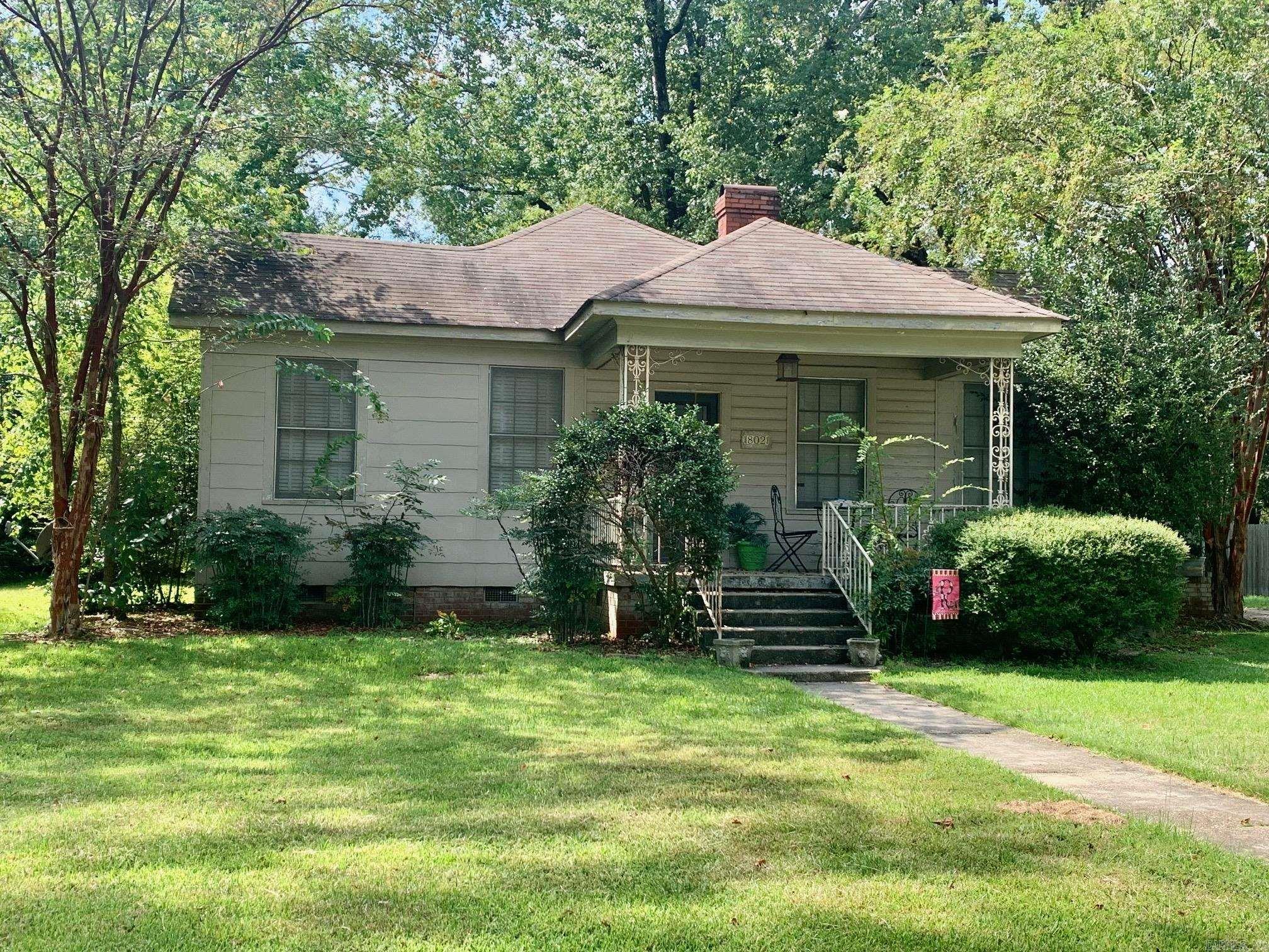 This property will be sold "AS IS'" with no repairs. Very cute home that has tons of potential. Large main bedroom, bathroom, and walk-in closet. 2nd and 3rd bathroom share a door, but that area could make a great playroom or office. Large den with built-ins. Original hardwood flooring in some rooms in this home. This could make someone a great home with just little TLC.