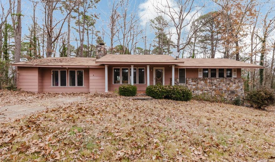 Check out this adorable steal!!  This home has tons of possibilities just waiting for you.  Lots of living space in this 2 bedroom, 2 bathroom spacious home sitting in a cul-de-sac on a good size lot.  You will love the native stone fireplace to snuggle on these cozy winter days (Fireplace has never been used but has a new chimney cap 2021).  Enjoy the large great room to entertain all your friends and family or turn it into an additional bedroom if you need to.  Lots of options and possibilities with this adorable spacious home and all that just waiting for you to make it yours.  Priced right!!!!  You will love all the amenities that the village has to offer.  Pools, lakes, golf courses and more!!!  Priced right and seller is selling AS IS and is not able to do any repairs.  LIST OF UPDATED:  Roof replaced 2018, new Microwave 2025, Entergy weatherization 2024 included insulated floor registers, added insulation in attic and fixed air ducts in crawlspace, kitchen, bath and bedroom floors replaced 2025, some paint 2025, new garbage disposal 2025, carpets and HVAC professionally cleaned 2025.  Call and schedule your showing and lets make this your new home!!