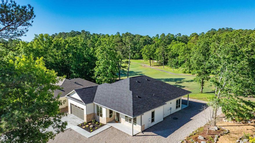 Discover Your Dream Golf Front New Construction Home! A motivated seller means a great value for a lucky home buyer without compromising quality or style. This custom home is located in the heart of Hot Springs Village on a quiet cul-de-sac.  Step inside and be greeted by an expansive open floor plan, bathed in natural light and boasting 10 foot ceilings and  8 foot solid core doors. The seamless flow between the living, dining, and kitchen areas creates an ideal space for entertaining and everyday living. Designer finishes are evident throughout, reflecting a commitment to quality and style.Enjoy a smart design that provides ample storage,  a large garage, & luxurious extras that make this perfect for your forever home. Relax & savor the natural beauty on the large patio with a par 3 view! Durable Exterior siding is Hardie cement board ensuring long lasting, low maintenance beauty resistant to the elements.Don't miss this opportunity to own a brand-new, move in ready home in the heart of Hot Springs Village. Ready for you to hit the tees and start enjoying all the Village has to offer.Agents please see remarks and see the features sheet in associated documents.
