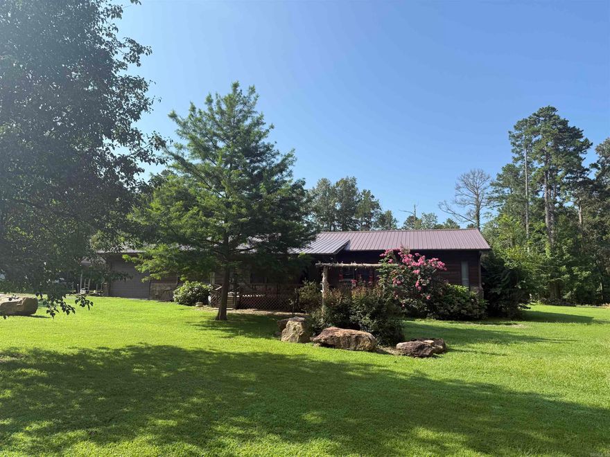 Spacious 3 bedroom and 2 bathroom cabin sitting on 1 acre awaits! Less than 10 minutes from Sugar Loaf Marina and offers plenty of storage for your boat, golf cart, and side by side. The property features lots of outdoor space with a large back deck for grilling and enjoying relaxing evenings after a day on the lake. The home has a new metal roof and added large landscape rocks throughout the yard to give it a unique feel. Schedule your showing today!