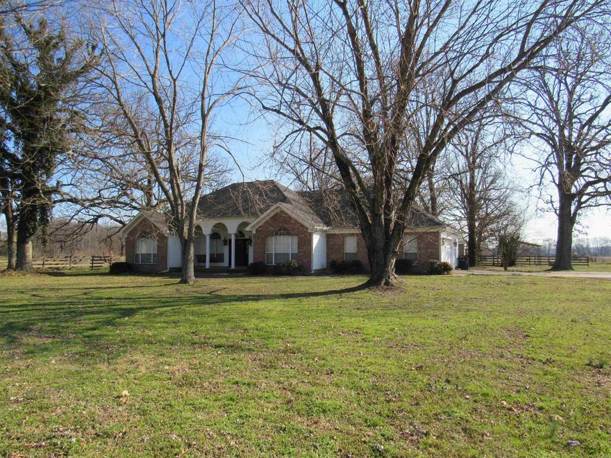 Experience country living at its finest in Carlisle! This unique 3-bedroom, 2.5-bath rental off Hwy 236 is a true rural dream, perfectly situated to offer peace & quiet with easy access to I-40, sitting just 15 min from Lonoke & Cabot, & only 20 min to Beebe. Nestled on 3 cross-fenced acres, this property is ideal for livestock or anyone needing a serious workspace. The site features an incredible 1,600 sq. ft. insulated drive-through shop equipped with electric, & 2-12-foot roll-up doors. Additional outdoor storage includes a detached carport & a 3-sided carport.  Inside, the home is full of character with beautifully crafted custom built-ins, bookshelves, & desks throughout. The spacious layout includes a primary suite, a dedicated office, a sunroom flooded with natural light, & a kitchen with a gas stove. Designed for country life, the home features a convenient half-bath/mudroom located right off the garage—the perfect place to clean up after working outside before entering the main living area.  Available NOW! Please note: a riding mower is required for the acreage, or professional lawn services can be provided for an additional fee added to the rent. Apply Today!