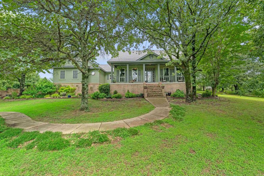 Enjoy your country sanctuary that's 20 mins from anything in all directions.! This meticulously maintained home sits on 9.22 acres! New roof was installed May 25! As you pull up the drive, you barely see the house hiding in the trees. Next thing you'll notice is the 2 car attached garage and the matching 2 car detached garage/shop. The one story home boasts the primary suite apart floor plan and semi open kit/living/dining. The Primary suite has amazing natural lighting with a stunning walk in shower and large closet. Extra rooms included! There is formal dining, and a sun room that shares a two sided fireplace with the living room. The seller has a green thumb and has beautifully landscaped the property for you. Cross fencing already in place. The pasture is approx 4 acres with access to the trees so animals can enjoy shade or shelter. The pen closer to the home is great for the smaller critters like chickens, pigs, goats, etc. Zoned for Beebe schools.  Don't miss the storm shelter under the front porch.