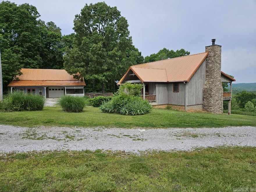 Very Nice House with great views of surrounding mountains has new heating and air unit two large walk in closets lots of storage space with built in storm room also   separate studio/mini apartment and one car garage with lots of storage up stairs . Has large deck with hot tub. This Home is very well insulated has newly installed full house generator.  The apartment is approx. 436 sqft