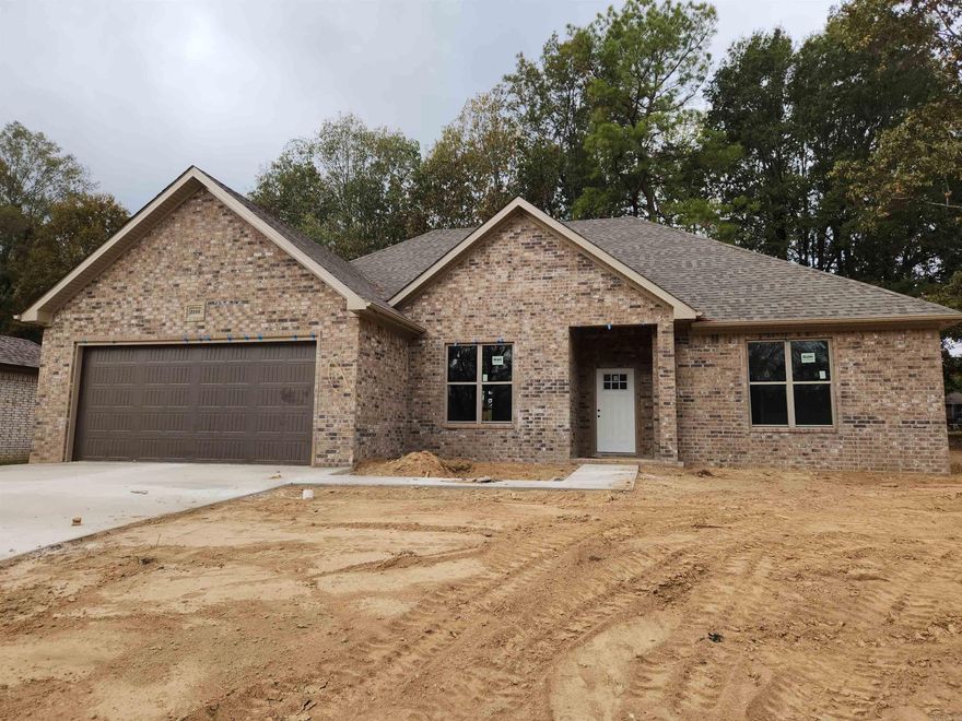 Beautiful new brick home!  This new construction has plenty to offer.  The open floor plan is perfect for large gatherings.  The large spacious living room and dining room with hold everyone for gatherings.  The kitchen has granite countertops and is perfect for anyone that enjoys cooking.  The covered patio will work for the outdoor lovers.  The main bedroom has coffered ceilings, double walk-in closet, double vanity, whirlpool tub and separate shower. The extra bedrooms are on the other side of the house for privacy. This home is setting in the cul-de-sac in a quiet neighborhood.  Call today for your personal tour.