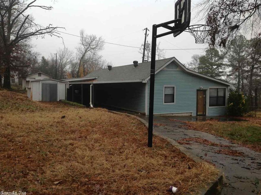 VERY MOTIVATED SELLER !!!!!! BRING ALL OFFERS! This place will get you close to lake Conway for fishing. You can see lake from property. Needs some TLC. 3/1, large kitchen, Fire Place with extra space. Outside storage bld. Taxes are est only from courthouse. property is sold "AS IS" and "WHERE IS".