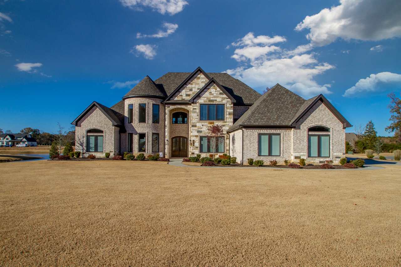 Stunning custom home opens to gorgeous view of water through living room w/hidden tv in wood feature wall,large master suite,office,formal dining, oversized laundry/mud room. Welcome the outdoors in w/additional wing designed as pool house includes sitting area w/ kitchenette and pass through window for easy access to outdoor kitchen,power shades and separate bathroom and laundry. Home is fully automated in main living and outdoor areas including security system with cameras and surround sound. See Remarks
