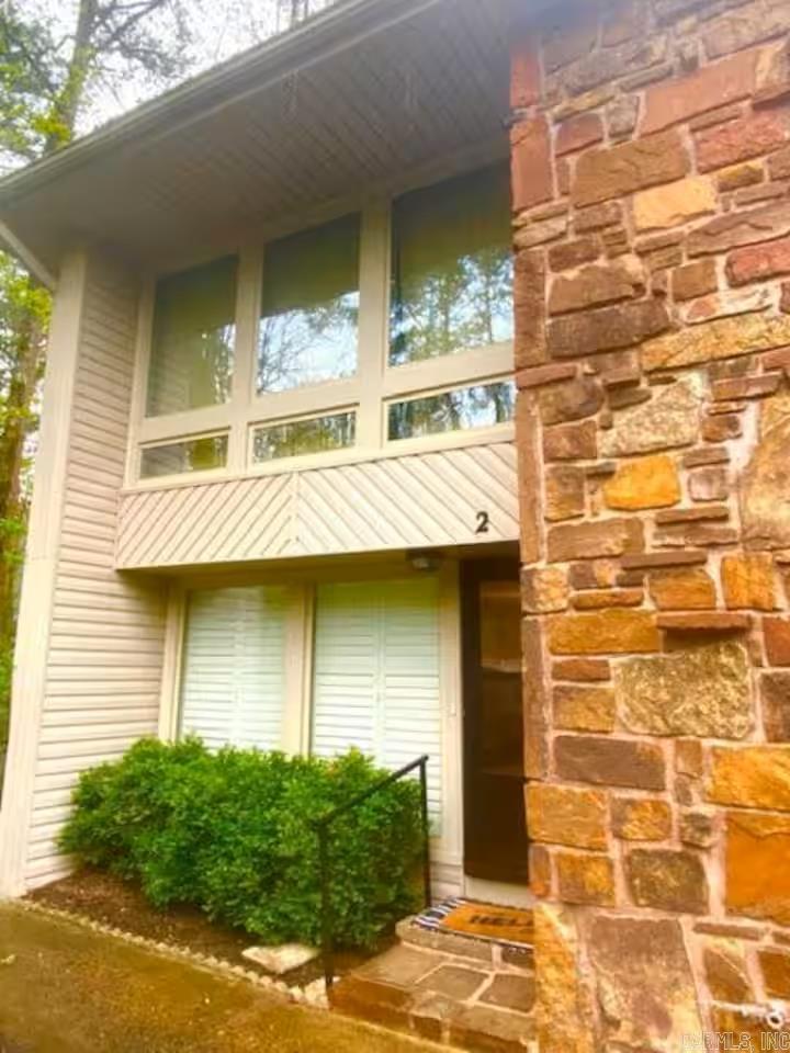 Welcome to this Adorable Townhome in Castellon Courts! Move-in ready spacious 2-bedroom, 2.5-bathroom two-level townhome that's completely furnished. Located near Lake DeSoto and easy walking distance to DeSoto Marina and nearby restaurants. Features of this fun and inviting property include a large living room with fireplace; reading nook; sunroom; well equipped kitchen; laundry area; office space in master bedroom; and bonus space below that you can use for extra storage or make into hobby/recreation room. Whether you're looking for a full-time residence; low-maintenance getaway; or investment property, this townhome provides a fantastic opportunity to enjoy the beauty and amenities of Hot Springs Village. Come see all that this property has to offer! See Agent Remarks for additional details.