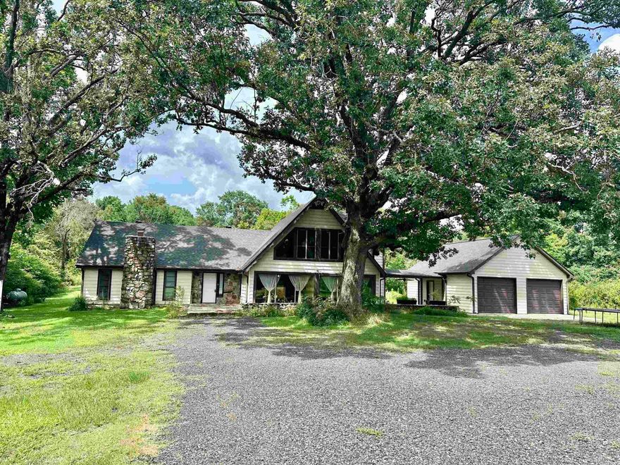 Oh My Goodness!! What a great home!! This 4 bedroom 3 full bath is amazing! It has 2 bedrooms downstairs and 2 upstairs, plenty of room for everyone! This house underwent a major remodel several years ago and they built the large garage and breezeway, new Geothermal heat/cool, at that time a Generac generator was installed to run home if electricity goes out, natural stone flooring downstairs, CUSTOM cabinetry, granite countertops and new paint and Sheetrock and more! There has been a new septic recently put too! The home has large beams in the vaulted kitchen/dining/den area with wood ceiling! Beautiful! The home sets way back off the road and has 9 acres. There is a small pond up front that needs some landscaping.  The attached garage has a floored upstairs room for ALL your storage needs. Another shop/garage is on the property too, it’s perfect for the zero turn and yard and garden tools and still room for a work shop! This home is only a couple miles from the largest lake in Mena- Wilhelmina Lake! Also, you’re in the Ouachita mountains and it’s a short trip to the National Forest and all its beauty! This home really checks A lot of boxes and then some!