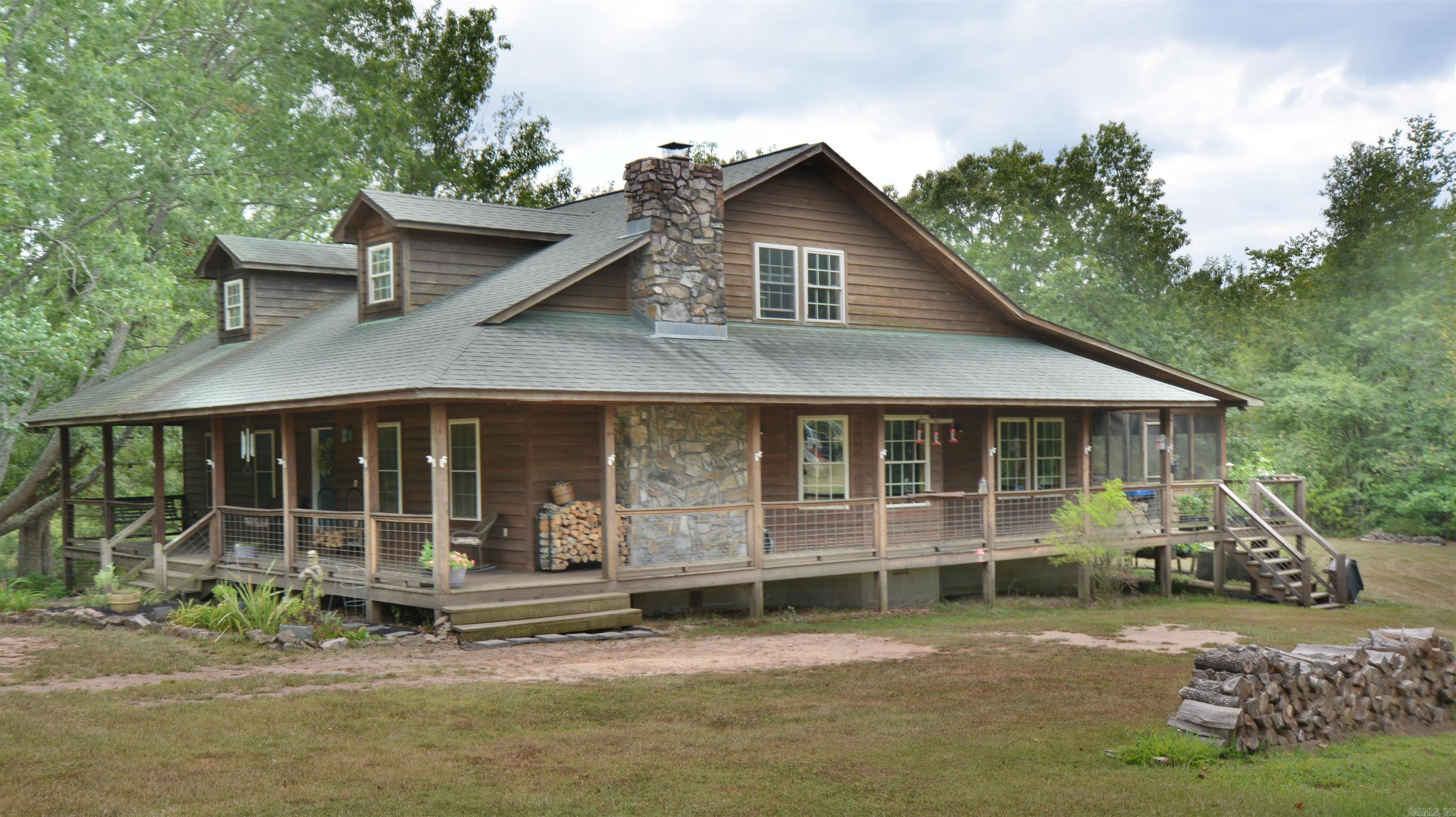 WANT TO LIVE OFF THE GRID---HERE IS YOUR PLACE ON 46 ACRES +/- FANTASTIC FARM HOUSE ON 46 ACRES WITH FLOWING CREEK THROUGH THE PROPERTY--UPON ENTERING ONE NOTICES THE BEAMED CEILINGS, STONE FIREPLACE, OPEN FLOOR PLAN, WOOD FLOORS, PARTIALLY UNFINISHED UP- STAIRS AREA (800 SQ FT) WITH ROUGHED IN BATH, WRAP AROUND PORCHES, SCREENED IN BACK PORCH, FRUIT TREES, LARGE GARDEN SPOT (IRRIGATED), FENCED & CROSSED FENCED, WORKING "ROUND PEN", CHICKEN COOP, & OUTSIDE STORAGE SHED. COME SEE WHAT CAN LIFE OFF THE GRID WOULD BE LIKE--